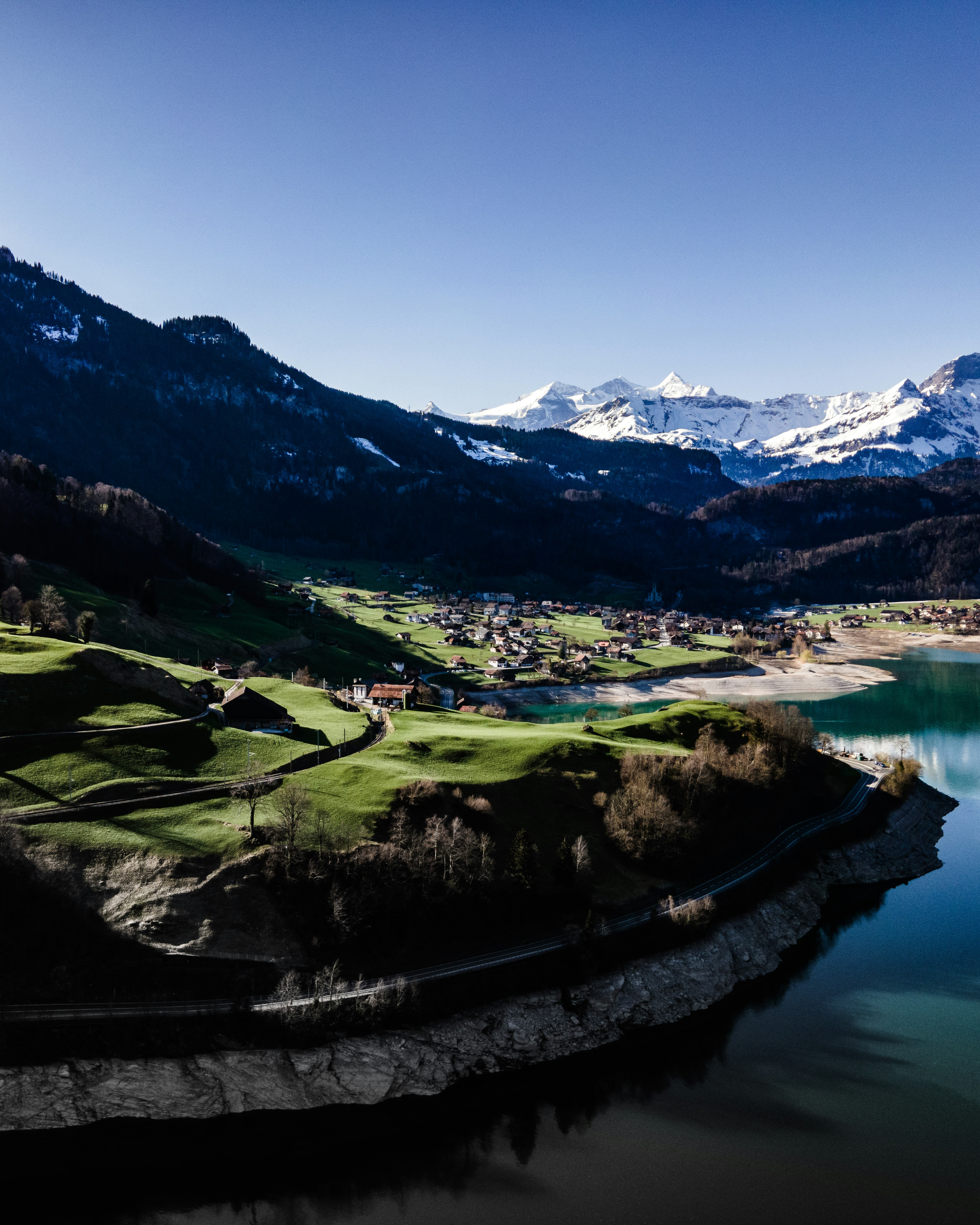 green mountains near body of water during daytime